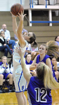 Bryant's Erica Smith pulls down a rebound in front of two Mount St. Mary players. (Photo by Kevin Nagle)