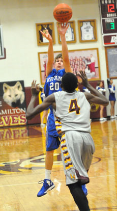 Bryant's Evan Lee (20) fires up a 3-pointer over Lake Hamilton's Jordan Hughes. (Photo by Kevin Nagle)