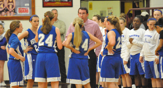 Head coach Nathan Castaldi huddles with his team. (Photo by Kevin Nagle)