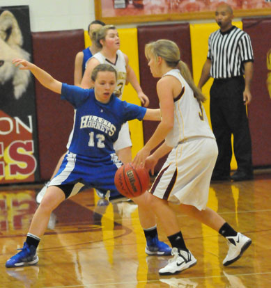 Bryant's Skylar Davis defends against Lake Hamilton's Elle Henson. (Photo by Kevin Nagle)