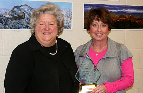 Sue Reeves, left, Bryant Middle School principal, and Tamra Lambert, recipient of the 2011-12 Bessie B. Moore Award 