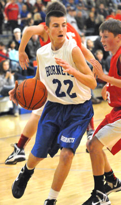 Jon Luke Sprout (22) drives around a Cabot South defender. (Photo by Kevin Nagle)