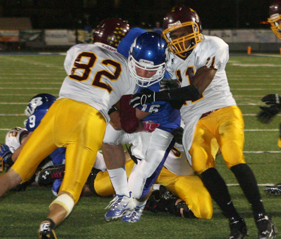 Bryant quarterback Hayden Lessenberry fights through two Lake Hamilton defenders to get to the end zone during last week's 49-14 win. (Photo by Rick Nation)