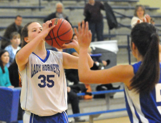 Bryant Blue's Reagan McCormick prepares to launch a jump shot. (Photo by Kevin Nagle)