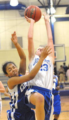 Kendal Rogers tries to finish off a drive to the basket. (Photo by Kevin Nagle)