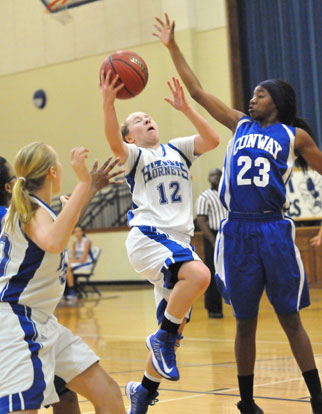 Skylar Davis prepares for contact as she goes up for a shot inside. (Photo by Kevin Nagle)