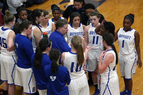 Bryant head coach Brad Matthews talks to his team during a timeout in Thursday's game. (Photo by Rick Nation)