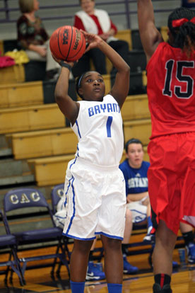 Destin Nichols (1) puts up a shot over Fairview's Jermeka Marks. (Photo by Rick Nation)