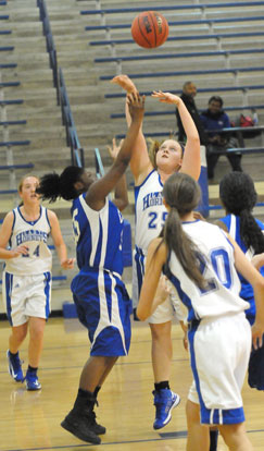 Anna Turpin (25) shoots in a crowd. (Photo by Kevin Nagle)