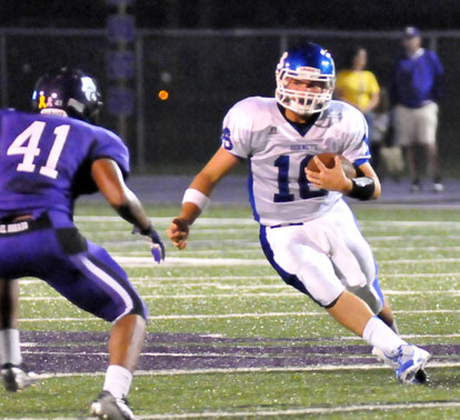 Hayden Lessenberry (16) scrambles to get past El Dorado linebacker Patrick Seweje. (Photo by Kevin Nagle)