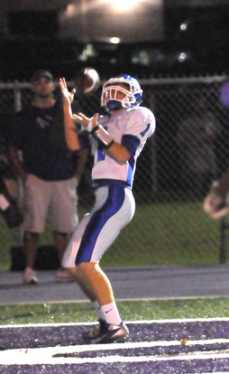 Austin Powell hauls in a pass for the first touchdown of Friday's game. (Photo by Kevin Nagle)