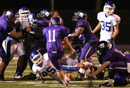 Drew Tipton (25) blocks a field goal attempt by El Dorado's Trent Harter (11). (Photo by Rick Nation)