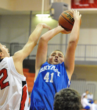 Dagan Carden leans on his shot to avoid a block. (Photo by Kevin Nagle)