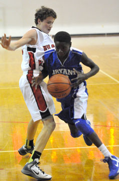 Bryant's Kevin Hunt drives past a Vilonia defender. (Photo by Kevin Nagle)