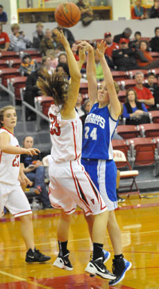 Britney Sahlmann shoots over Vilonia's Lauren Rappold. (Photo by Kevin Nagle)