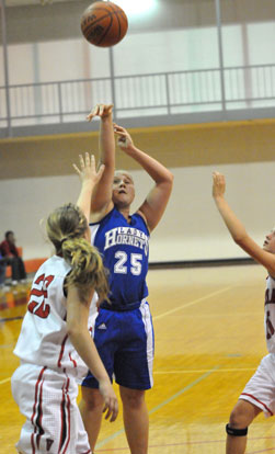 Anna Turpin (25) shoots over Vilonia's Jessica Brandon (22). (Photo by Kevin Nagle)