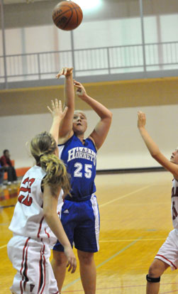 Anna Turpin (25) shoots over Vilonia's Jessica Brandon (22). (Photo by Kevin Nagle)