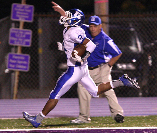 Bryant receiver Brushawn Hunter scores against El Dorado as Hornets fan and Bryant school board member Joe Wishard celebrates. (Photo by Rick Nation)