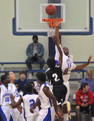 Cameron Murray (55) goes high to try to block the shot of Maumelle's Barry Nixon. (Photo by Kevin Nagle)