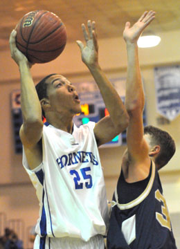 Bryant's Jaelyn Jones (25) shoots over Pulaski Academy's Robert Ator. (Photo by Kevin Nagle)