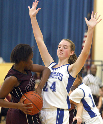 Britney Sahlmann (24) defends. (Photo by Rick Nation)