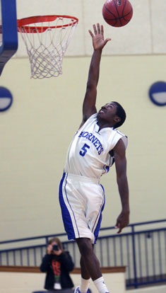 Kris Croom goes high on a shot attempt. (Photo by Rick Nation)