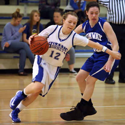 Skylar Davis (12) drives past Conway's Savannah Lowe. (Photo by Rick Nation)