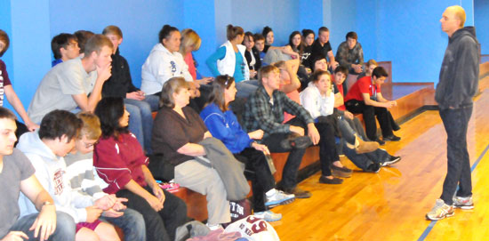 Former Olympic Gold medalist Rowdy Gaines talks to the Bryant swim team. (Photo by Kevin Nagle)