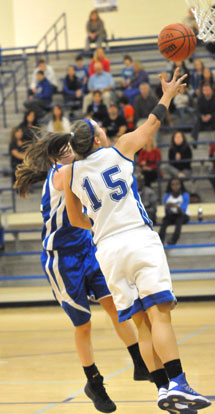 Peyton Ramsey (15) goes up for a shot. (Photo by Kevin Nagle)