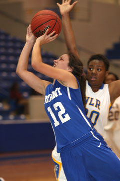 Madeleine Baxter (12) goes up for a shot in front of North Little Rock's Arbiniee Phillips. (Photo by Rick Nation)