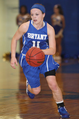 Logan Davis pushes the ball up the floor. (Photo by Rick Nation)