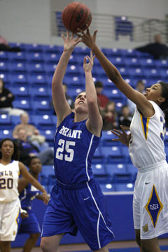 Erica Smith (25) gets a shot up despite an attempt at blocking it by North Little Rock's Jade Hunter. (Photo by Rick Nation_