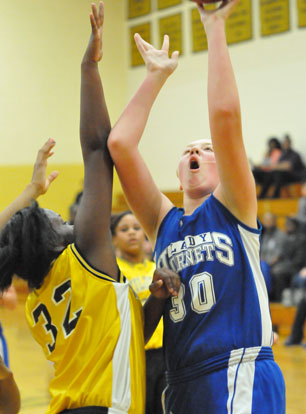 Rachel Miller (30) shoots over a Watson Chapel defender. (Photo by Kevin Nagle)