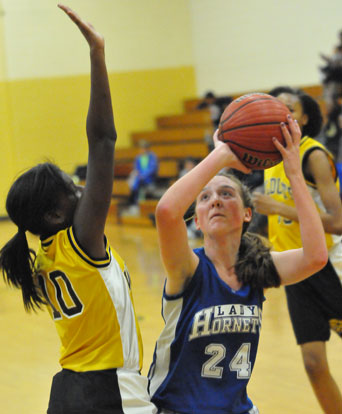 Britney Sahlmann pump-fakes a Watson Chapel defender into the air. (Photo by Kevin Nagle)