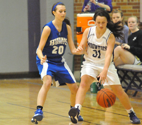 Bryant's Kailey Nagle (20) pressures a Mount St. Mary ballhandler. (Photo by Kevin Nagle)