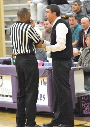 Bryant coach Nathan Castaldi discusses a call with one of the officials at Monday night's game. (Photo by Kevin Nagle)