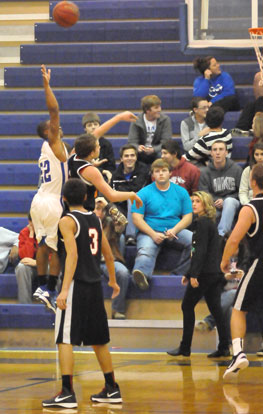 Bryant's Brushawn Hunter (22) goes high to get a shot away. (Photo by Kevin Nagle)