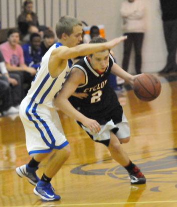 Bryant's John Winn (20) guards Russellville's Kregan Kordsmeier. (Photo by Kevin Nagle)