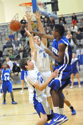 Evan Lee (20) and Dagan Carden (41) trap a Conway Blue player at the baseline. (Photo by Kevin Nagle)