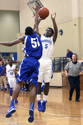 Kris Croom (5) fires a shot over Conway Blue's Dequne Graham. (Photo by Rick Nation)