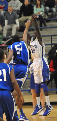 Bryant's Kevin Hunt (10) launches a 3-pointer over Conway Blue's Dequne Graham. (Photo by Kevin Nagle)