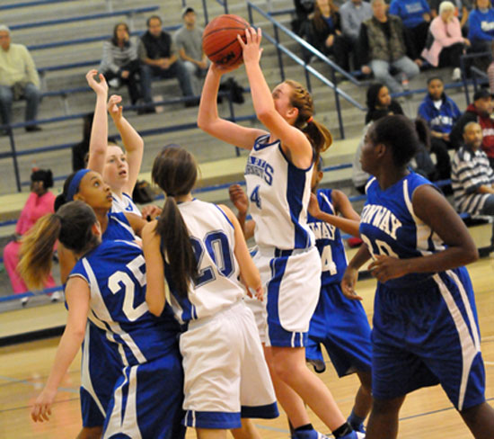 Britney Sahlmann goes up for a shot in the clogged up lane. (Photo by Kevin Nagle)