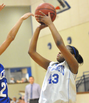 Deja Rayford launches a shot for Bryant White. (Photo by Kevin Nagle)