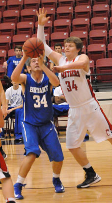 Bryant's Ryan Hall, left, prepares to go up for a shot inside. (Photo by Kevin Nagle)