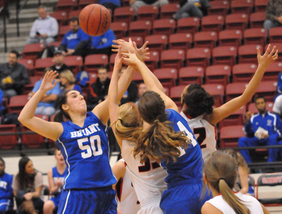 Bryant's Whitney Meyer (50) and Peyton Weaver (14) mix it up inside with Cabot's Ally Van Eck and Alyssa Hamilton. (Photo by Kevin Nagle)