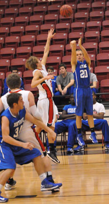 John Winn (20) tries a 3 from the corner. (Photo by Kevin Nagle)