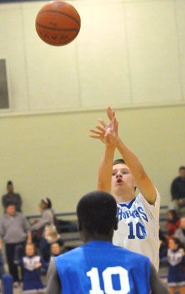 Bryant White's Jake East fires up a shot over Blue's Caylin Allen. (Photo by Kevin Nagle)