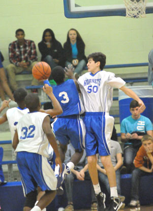 Bryant White's Kyle Sahr (50) goes up to try to block a shot by Calvin Allen (3). (PHoto by Kevin Nagle)