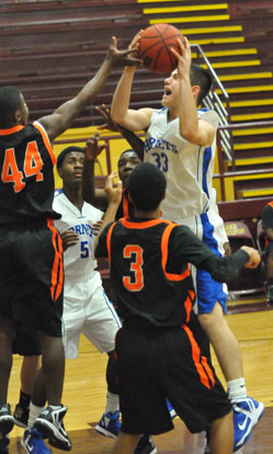 Clay Ingold (33) tries to go up strong in traffic. (Photo by Kevin Nagle)