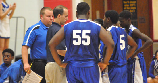 Bryant freshman coaches Mike Simmons and Brett Haugh instruct during a timeout. (Photo by Kevin Nagle)
